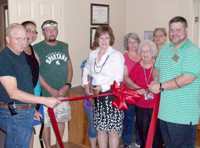 Accounting Services, Inc. Owner/Operator Sarah Rossell is joined by staff member Lance Raimer (far right), clients and Ionia Area Chamber of Commerce ambassadors at a ribbon cutting for her new business Saturday.