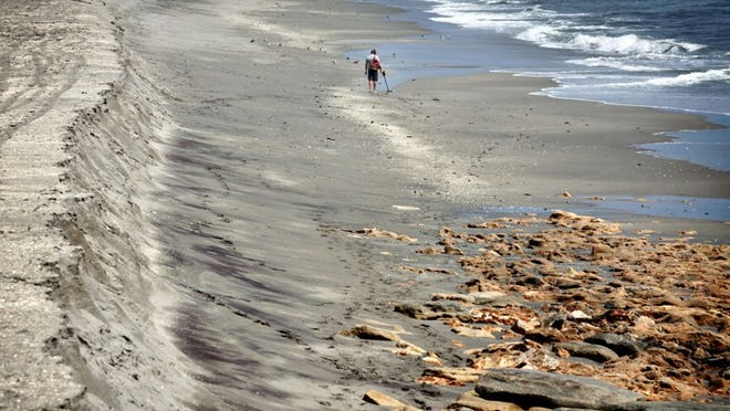 082812 (Richard Graulich/The Palm Beach Post) Jupiter - Rocks are exposed next to a six foot shelf of sand erosion at Coral Cove Park Tuesday.