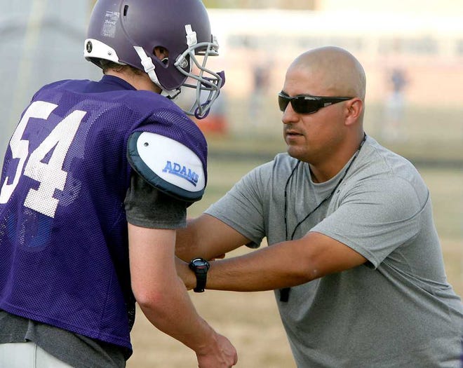 First-year Topeka West coach John Tetuan, coaching a lineman this summer, believes he can turn around a program that hasn't won since 2009. "The biggest thing is just changing the attitude around here, because we have a lot of athletes," Tetuan said.