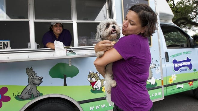 Che Angela Strasser and her dog Milo were among Enzor's customers earlier this month when she parked the trucknear Norwood Estate dog park off East Riverside Drive. The trailer is Austin's first dog treat trailer, which also sells water for pets and their owners.