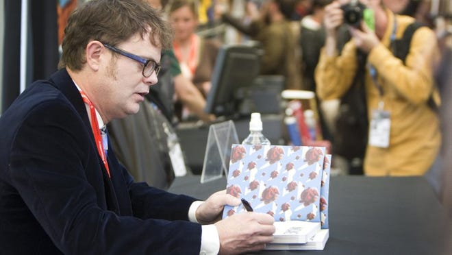 'The Office' actor Rainn Wilson signs his book, 'SoulPancake,' during a South by Southwest Interactive session Saturday.