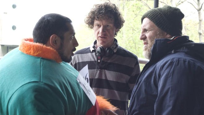 Chris Morris, center, directs Riz Ahmed, left, and Nigel Lindsay as bumbling British terrorists in 'Four Lions.'