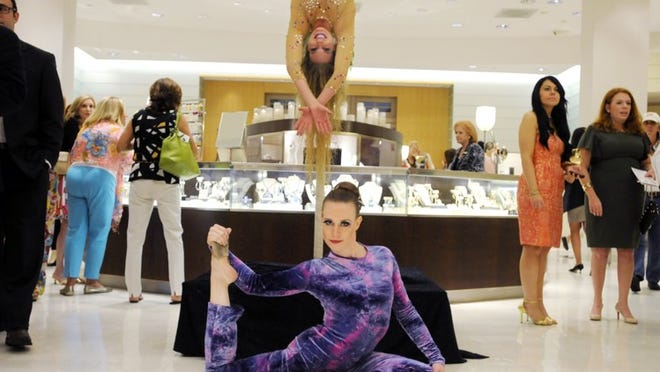 Acrobats perform for guests at Neiman Marcus during the 2011 Fashion’s Night Out.