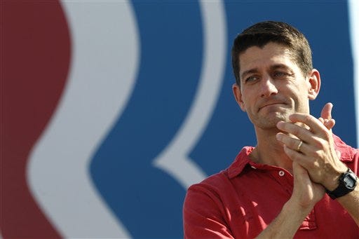 Republican vice presidential candidate, Rep. Paul Ryan, R-Wis. claps as presidential candidate, former Massachusetts Gov. Mitt Romney speaks at a campaign event, Saturday, Sept. 1, 2012, in Jacksonville, Fla. (AP Photo/Mary Altaffer)