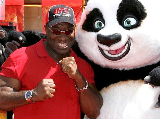 In this Sunday, June 1, 2008 photo, actor Michael Clarke Duncan poses with "Kung Fu Panda" at the premiere of the movie in the Hollywood area of Los Angeles. Duncan has died at the age of 54 on Monday, Sept. 3, 2012 in a Los Angeles hospital after nearly two months of treatment following a July 13, 2012 heart attack, his fiancee, the Rev. Omarosa Manigault, said. (AP Photo/Gus Ruelas)