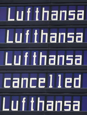 A flight information board at Munich Airport tells the story of Lufthansa's canceled flights.