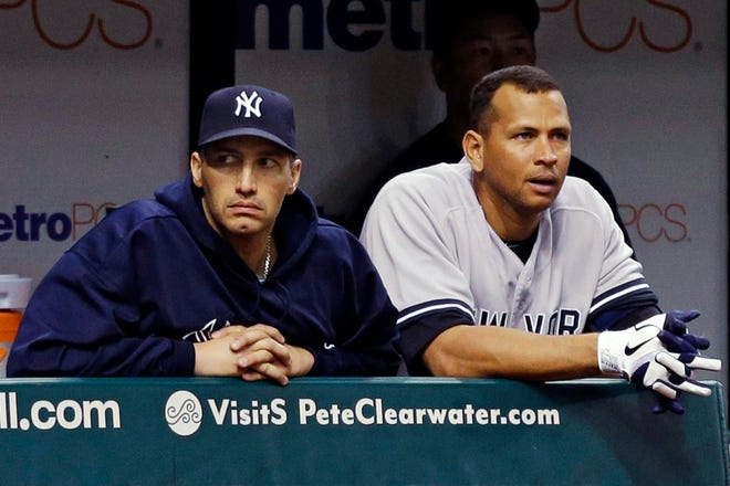 New York Yankees' Andy Pettitte, left, and Alex Rodriguez watch from the dugout during the eighth inning of their 5-2 loss to the Tampa Bay Rays during a baseball game, Tuesday, Sept. 4, 2012, in St. Petersburg, Fla. (AP Photo/Chris O'Meara)