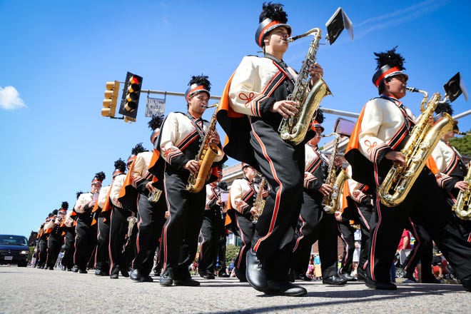 The Marlborough High School Marching Band makes its way down Main Street in Marlborough for the annual Labor Day parade on Monday.