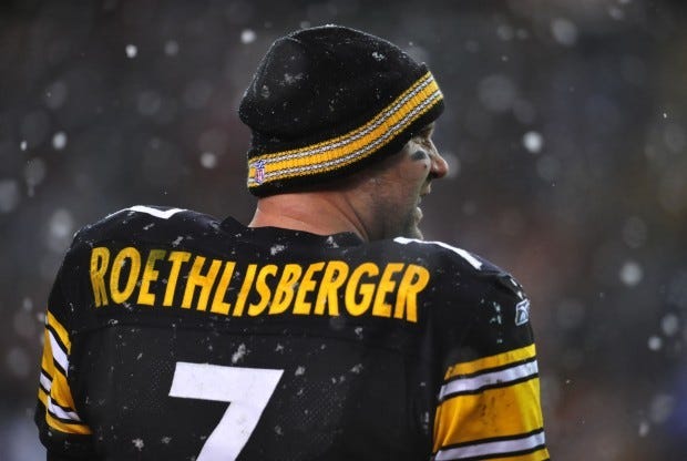 Roethlisberger watches the game from sidelines as snow swirls
around him.