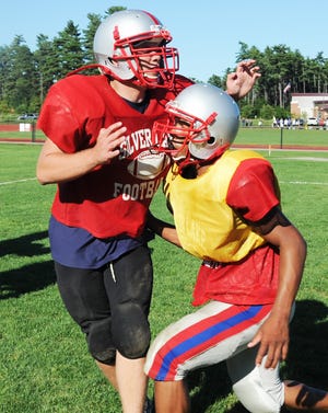 From left, Jack Zona, and Xavier Dillingham, during Silver Lake High School football practice on Wednesday, Aug. 29, 2012.