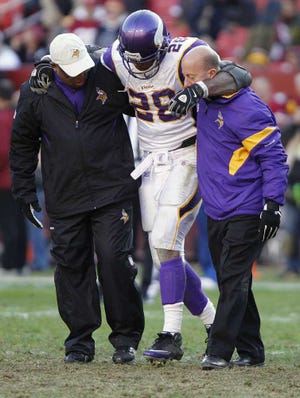 Evan Vucci Associated Press Minnesota Vikings running back Adrian Peterson is helped off the field after an injury against the Washington Redskins on Christmas Eve of last year in Landover, Md. His availability against the Jaguars in Sunday's season opener is still unknown.