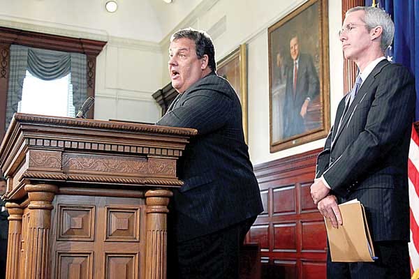 AP Photo/Mel Evans Gov. Chris Christie, left, stands with Robert M. Hanna, president of the state Board of Public Utilities in Trenton Wednesday.