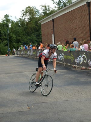 Nickel crosses the finish line after the 180-mile
Pelotonia ride.