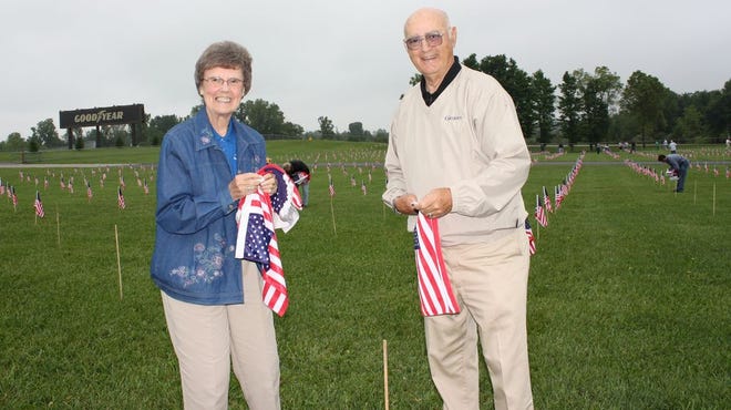 Community members were pictured placing flags at the MIS Unity Field in 2011.