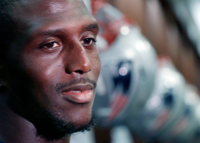 Patriots cornerback Devin McCourty speaks to reporters in the locker room at Gillette Stadium on Wednesday.