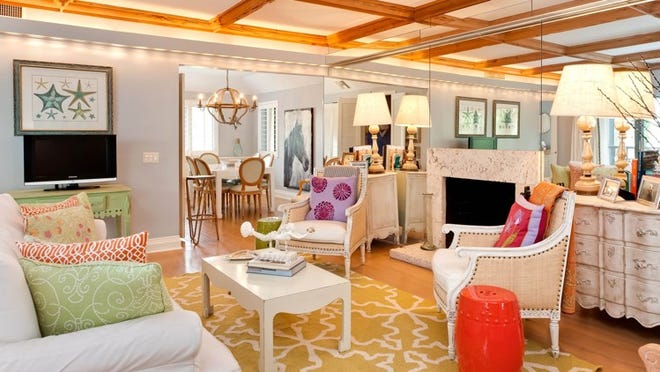 For the public spaces, homeowner and decorator Sterling Kenan chose a neutral palette for the walls and then added jolts of bright colors in the accessories. The beams are made of pecky cypress, and the floor is hardwood. The apartment is listed for sale at $925,000 by Sotheby’s International Realty.