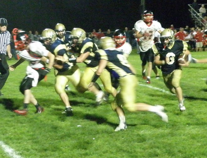 Logan Snyder runs 14 yards for the touchdown against United.