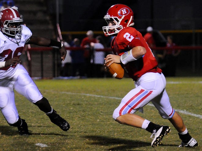 Hillcrest quarterback Riley Nix takes off with the ball against Hartselle.