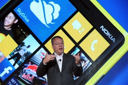 Nokia President and CEO Stephen Elop debuts the Nokia Lumia 920, Nokia's flagship Windows Phone 8 smartphone, at a press event in New York, Wednesday, Sept. 5, 2012. The Lumia 920 features a camera able to take in five times more light than competing smartphones for sharp pictures in low light without flash, and the phone comes with integrated wireless charging and a suite of location-based apps for personalized mapping and navigation. (Photo by Diane Bondareff/Invision for Nokia/AP Images)