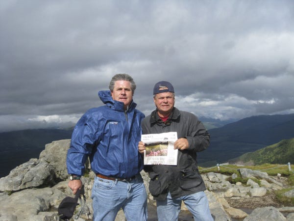 Michael Roesch, left, of Delaware and Russell Howard of New Albany enjoy the view atop Aonach Mor, Scotland. The climbers suggest wearing warm clothes to scale the United Kingdom's highest mountain, Ben Nevis, and warming up afterward with a visit to the Ben Nevis whiskey distillery.