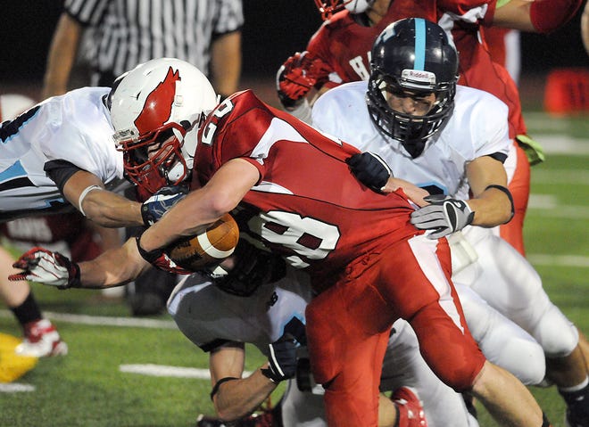 Franklin's Gene Grella (left) and Robert Dellorco take down Milford's Thomas Hytholt Friday in Milford.