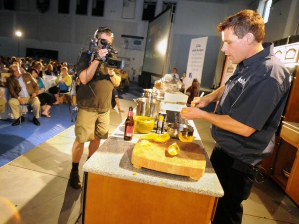 Chef Jon Ashton cooks for a crowd at the Schwartz Center during the Dash Around the Table tour in Wilmington Saturday, September 8, 2012.