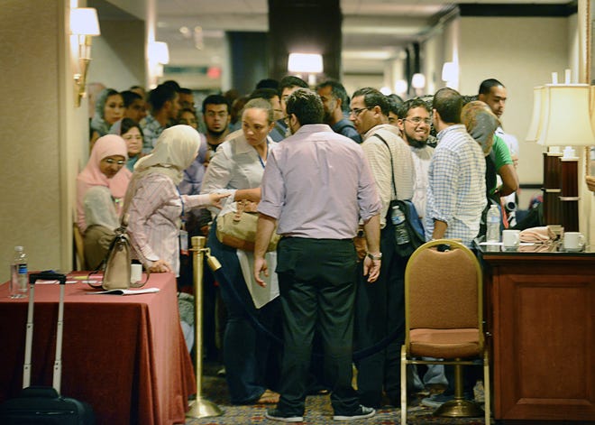 Muslims line up for a speed-dating session Sept. 1 at the annual convention of the Islamic Society of North America in Washington, D.C.