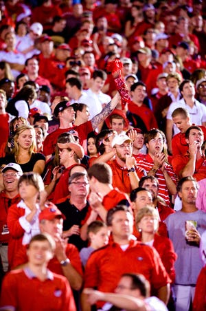 Georgia fans celebrate their win over the Missouri Tigers at the end of the fourth quarter Saturday at Memorial Stadium. MU athletics staff estimated about 8,000 Georgia fans were in attendance. More than 71,000 tickets were sold for the game.