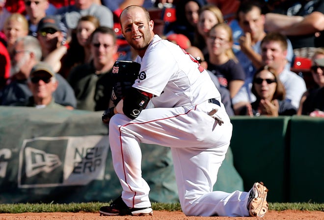 Dustin Pedroia kneels after grounding out to end the eighth ninth inning during the Red Sox' 4-3 loss to the Toronto Blue Jays on Sunday.
