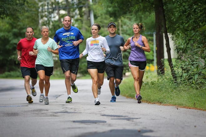 Ashland residents from left, Paul Palma, Colleen English, Rob Kulaga, Suzy Reap, Chris Boulanger, and Cheri Boulanger go for a training run in preparation for the town's first half marathon.