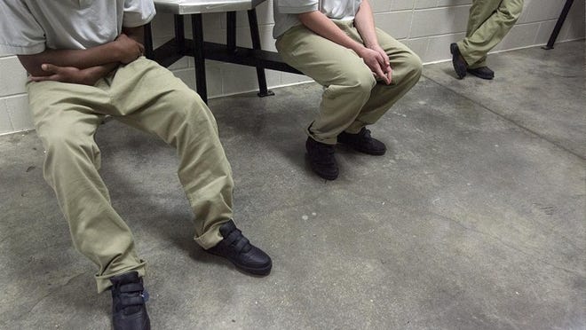 Young offenders gather for a visitors' tour of the Phoenix Program at McLennan County State Juvenile Correctional Facility near Waco. Corrections officials say the program, which places the state's most violent youths in a high-security environment, has helped reduce assaults at Texas' six youth lockups.