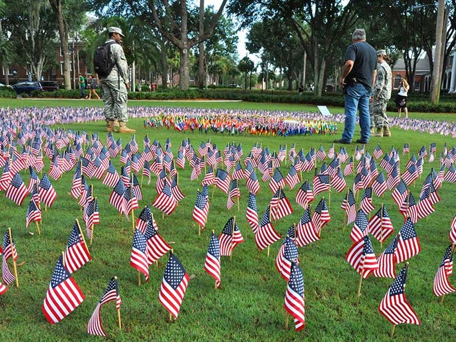 A field of flags are displayed on campus near the Carlton Union Building during an observance of the terrorist attacks of 9/11, at Stetson University in DeLand, on Tuesday, Sept. 11, 2012.