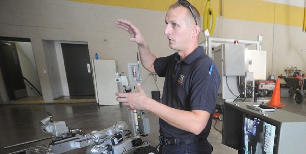 Robert Cain, Bethlehem Fire Department Bomb Squad technician, talks about the Andros F6b and all its components, including an Openvision X-ray unit, similar to that which would be used in an airport. “With this robot, there's almost no reason anymore to send in a guy in a protective suit to handle a dangerous object,” says Cain.