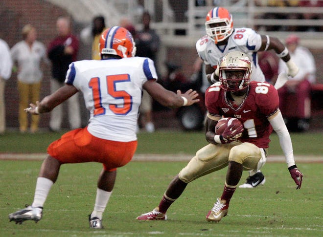 Florida State's Kenny Shaw gets around Savannah State's Cicerio Printup Saturday during the first quarter.