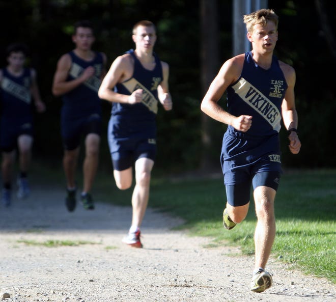 East Bridgewater High's Tanner Picklus, right, led the Vikings to a win over Cohasset/Hull on Tuesday with a first-place time of 16:32 at East Bridgewater on Tuesday.