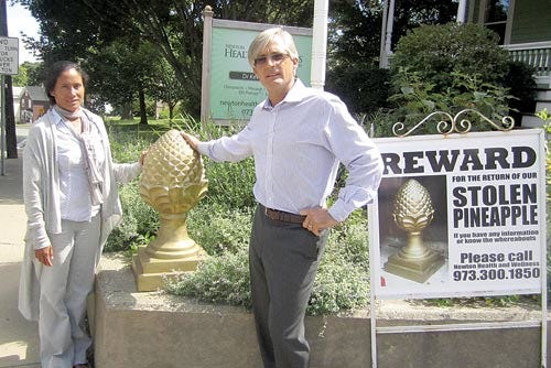 Photo by Steven Reilly/New Jersey Herald - Dr. Kevin Shaw and his wife, Ati, have offered a reward for return of the sculpture, one of a pair that stood at the entrance to their office driveway.