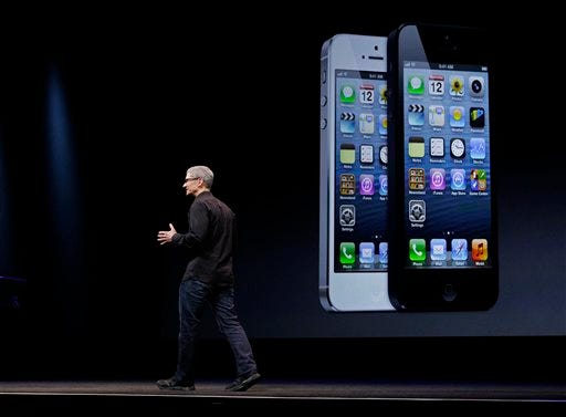 AP Photo/Eric Risberg — Apple CEO Tim Cook during an introduction of the new iPhone 5 in San Francisco, Wednesday, Sept. 12, 2012.