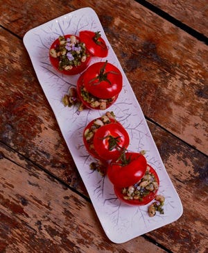 Ripe tomatoes stuffed with white beans and pesto make the most of the late-summer tomato crop.