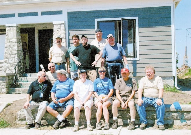 Members of the First Presbyterian Church of Goshen and Union Presbyterian and Calvary Presbyterian Church, both in Newburgh, are seated with Ed Hanna, front row far left, after rebuilding his tornado-damaged home in Joplin, Mo.