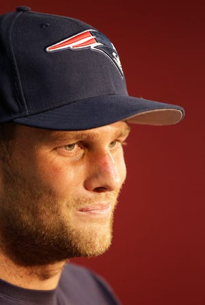 New England Patriots quarterback Tom Brady listens to a reporter's question during a media availability at the NFL football team's facility in Foxborough, Mass., Wednesday, Sept. 12, 2012. (AP Photo/Stephan Savoia)