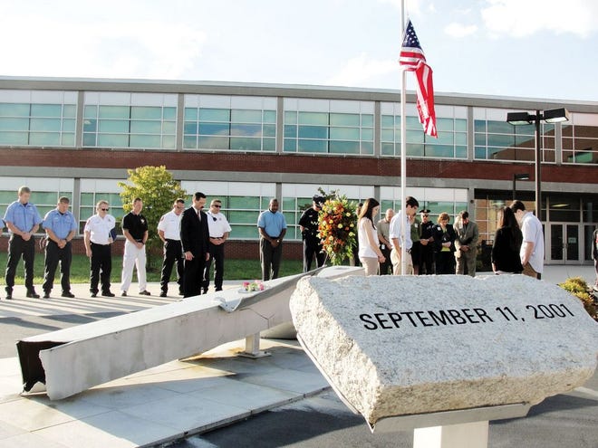 Oak Ridge firefighters and police officers join students and staff at Oak Ridge High School on Tuesday morning to pay tribute to the victims of the Sept. 11, 2001, terrorist attacks.