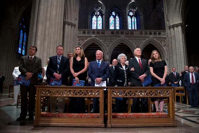 Former astronauts Buzz Aldrin, center, Annie Glenn, and her husband, astronaut, and former Ohio Sen. Sen. John Glenn, second from right, take part in a memorial service for Apollo 11 astronaut Neil Armstrong, Thursday, Sept. 13, 2012, at the National Cathedral in Washington.
