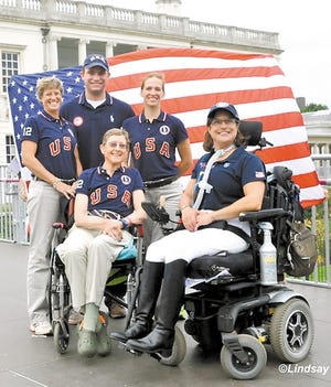 Donna Ponessa is seated at right with her team at the Paralympic Games in London earlier this month. Pictured are Missy Ransehousen (Chef d’Equipe), Jonathan Wentz (Grade 1b) Rebecca Hart (Grade II) and Dale Dedrick (Grade 11), seated left.