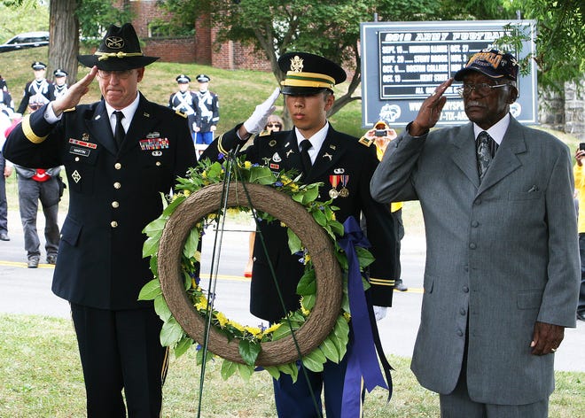 Honoring the famed 9th and 10th Cavalry Regiments of the Buffalo Soldiers during an annual memorial service at West Point are, from left, Brig. Gen. Theodore Martin, commandant of the West Point Corps of Cadets, 2nd Lt. Edward Chao, Military Police honor guard, and World War II Buffalo Soldier Sanders Matthews.
