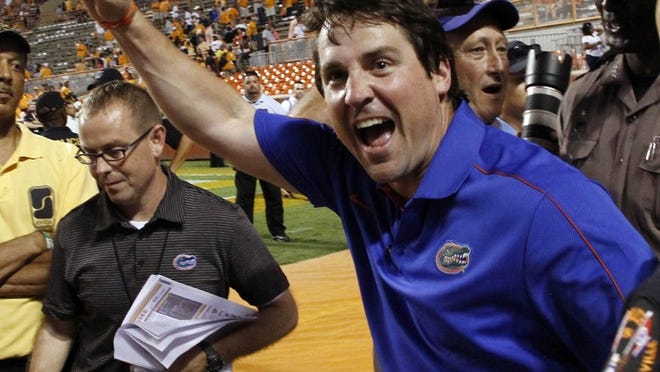Florida head coach Will Muschamp celebrates their 37-20 win over Tennessee in an NCAA college football game on Saturday, Sept. 15, 2012, in Knoxville, Tenn. (AP Photo/Wade Payne)
