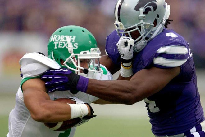 North Texas wide receiver Brelan Chancellor (3) got in the grill of Kansas State linebacker Arthur Brown (4) during the first half of Saturday's game in Manhattan. The Mean Green got in K-State's face early before falling late, 35-21.