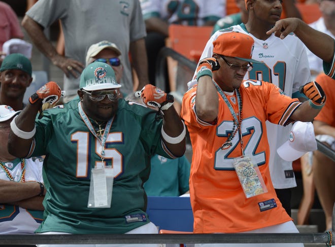 Miami Dolphins fans celebrate during the second half of Sunday's NFL football game against the Oakland Raiders in Mami.