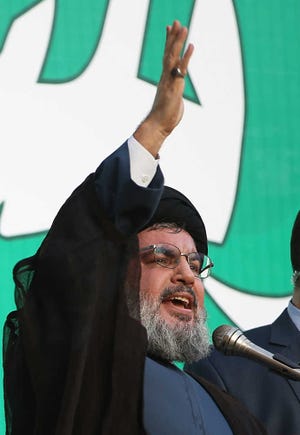 Hezbollah leader Sheik Hassan Nasrallah speaks Monday to a crowd of tens of thousands of supporters during a rally denouncing an anti-Islam film that has provoked a week of unrest in Muslim countries worldwide, in a southern suburb of Beirut, Lebanon. Nasrallah who does not usually appear in public for fear of assassination, called for protests in Beirut, saying the U.S. must be held accountable for the film because it was produced in America.