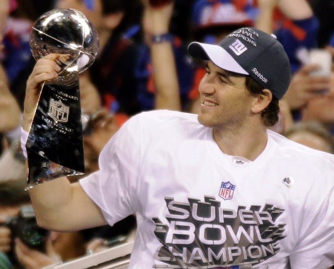 New York Giants quarterback Eli Manning holds the Vince Lombardi Trophy after the NFL Super Bowl XLVI football game against the New England Patriots, Sunday, Feb. 5, 2012, in Indianapolis. The Giants won 21-17.