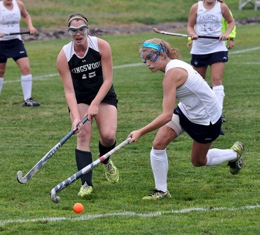 Whaley/Democrat photo
St. Thomas' Ashlie O'Brien, right, chases after the ball with Kingswood's Rachel Lapar during Division II action Tuesday in Dover.